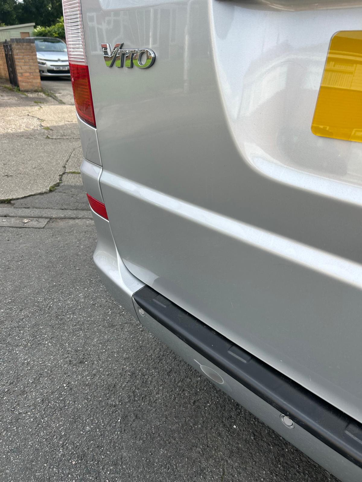 The dent on the silver Mercedes is fixed.
