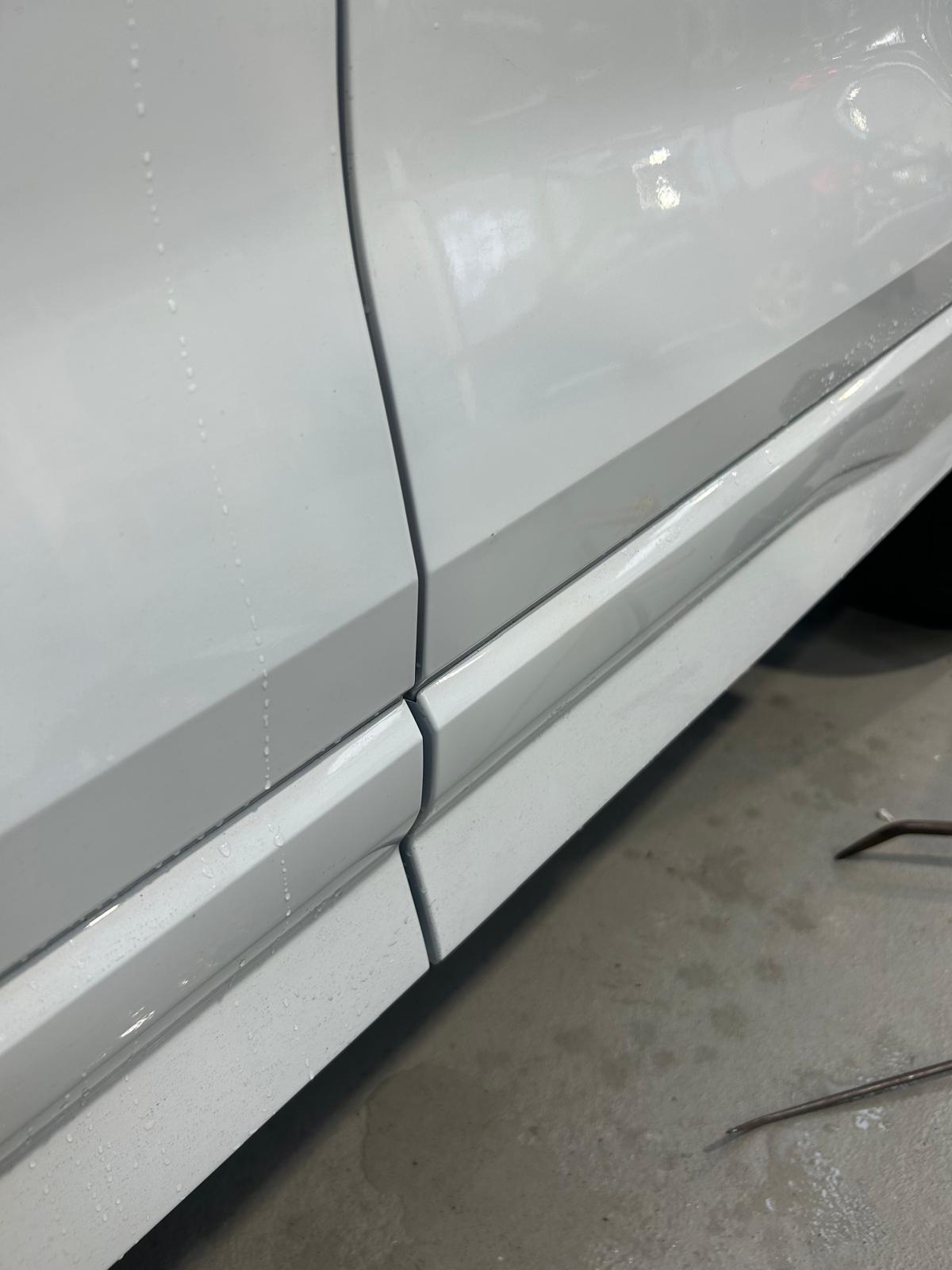 The dent on the silver car is fixed.