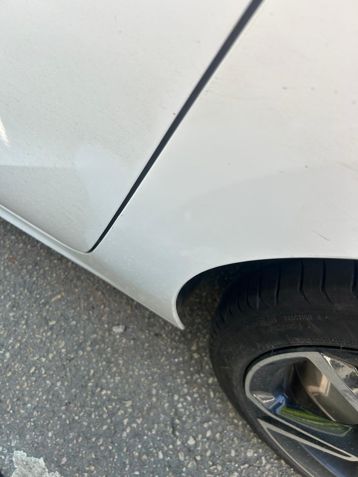 The dent on the silver Vauxhall is fixed.